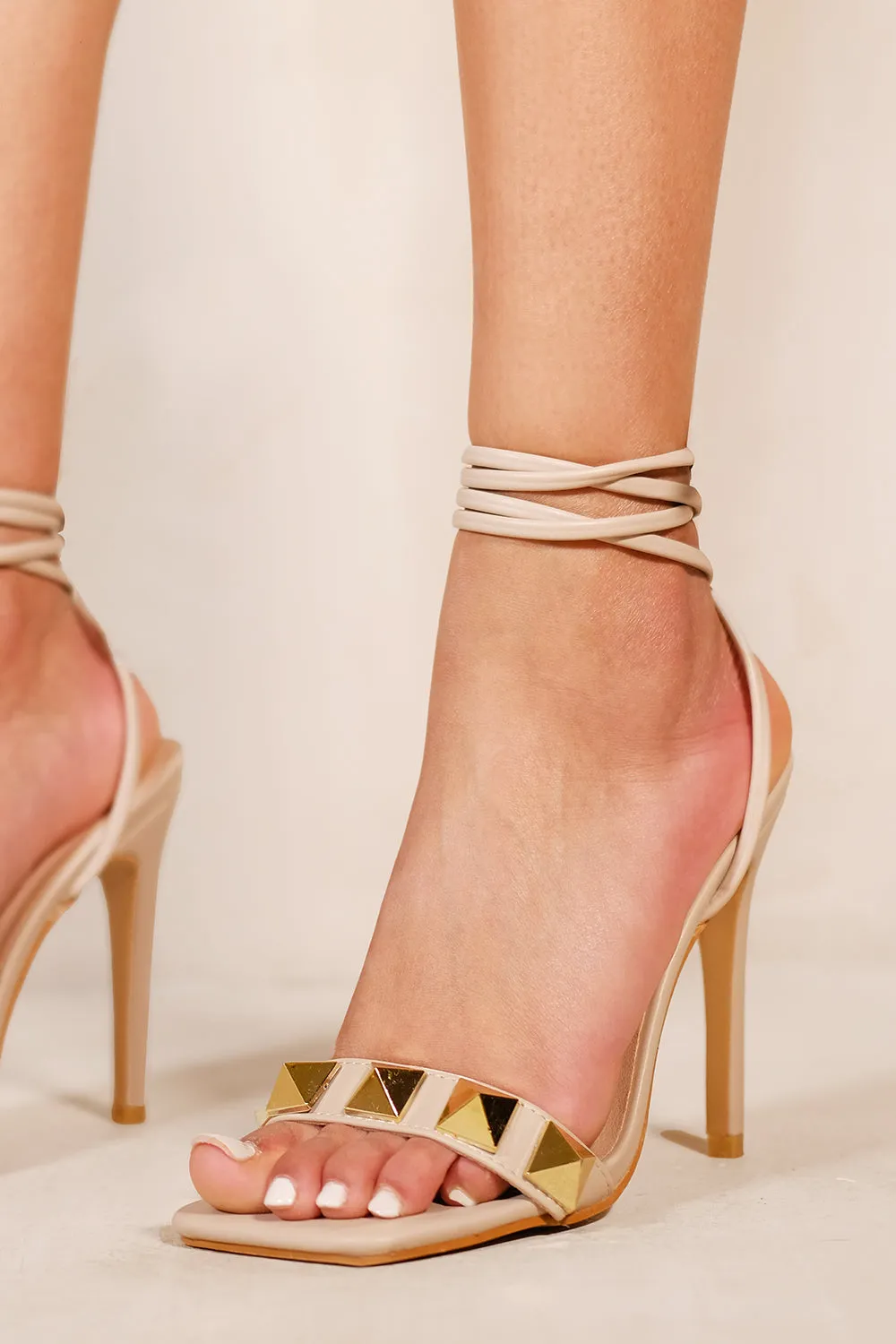 MIYA STUDDED HIGH HEELS WITH SQUARE TOE & LACE UP DETAIL IN NUDE FAUX LEATHER